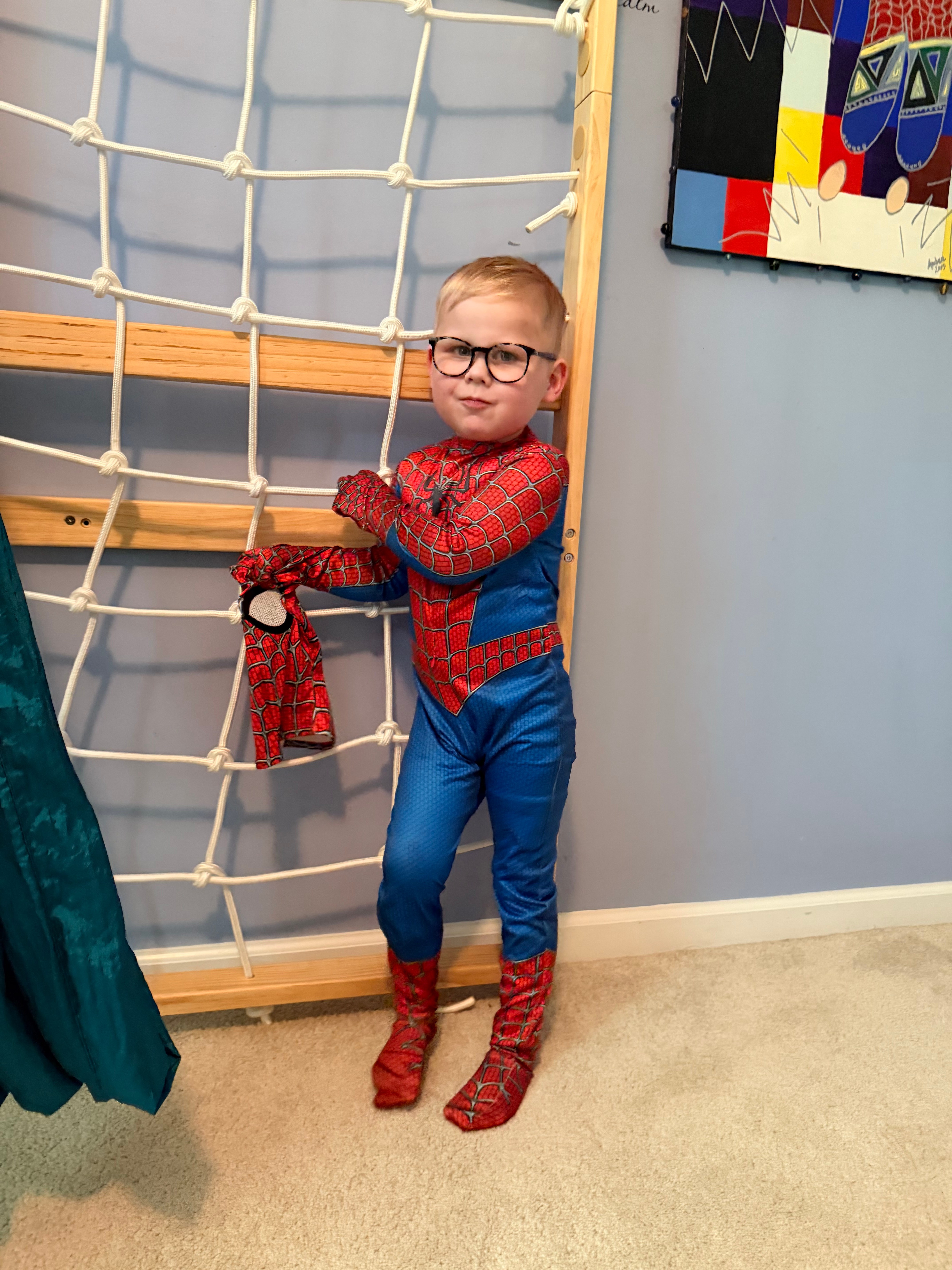 Felix standing tall in a Spider-Man costume, ready for anything
